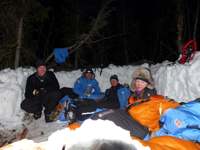 group lying in snow