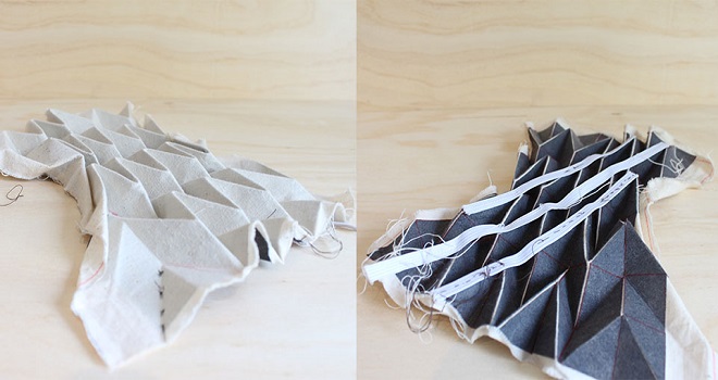 Another test to achieve the origami structure without having extensive fold involved. This process involved cutting the pattern out of interfacing and ironing it onto a sheet of fabric. This leaves the crease lines weaker than the body of the fabric. This technique also allows for greater variation in the pattern of the structure. You can create corners and curves rather than flat panels. Then elastic was sewn along the ribs to try and create a geometry that was no bigger than the objects it needs to carry.