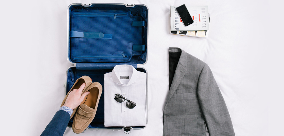 https://www.carryology.com/wp-content/uploads/2017/07/how-to-travel-with-a-suit.jpg