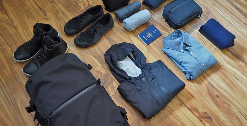 https://www.carryology.com/wp-content/uploads/2019/04/The-Best-Clothes-for-a-Mens-Travel-Capsule-Wardrobe.jpg