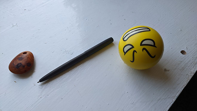 Fisher Space Pen and stress ball for mental health aids