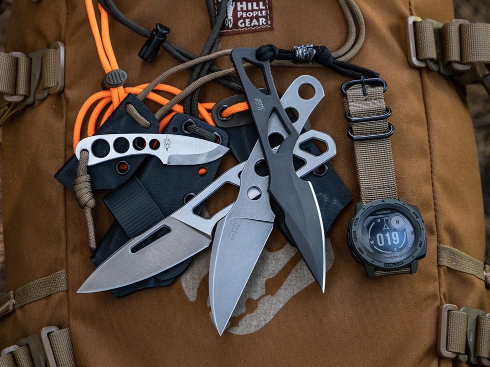 Top to bottom: Spartan Enyo, RaptorArtur Claw, TRC Speed Demon, and Wenger Blades neck knife in the corner, watch for size reference