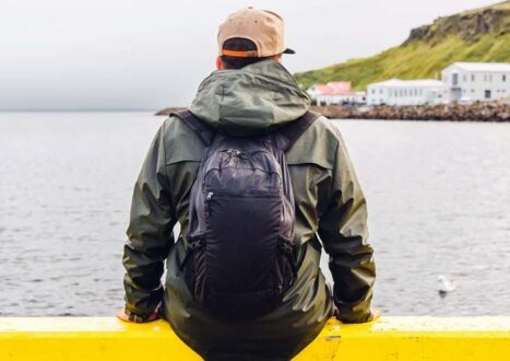 man wearing travel backpack