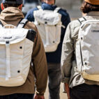 Four guys walking with backpacks