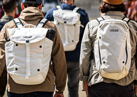 Four guys walking with backpacks