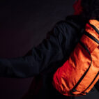 man with orange backpack