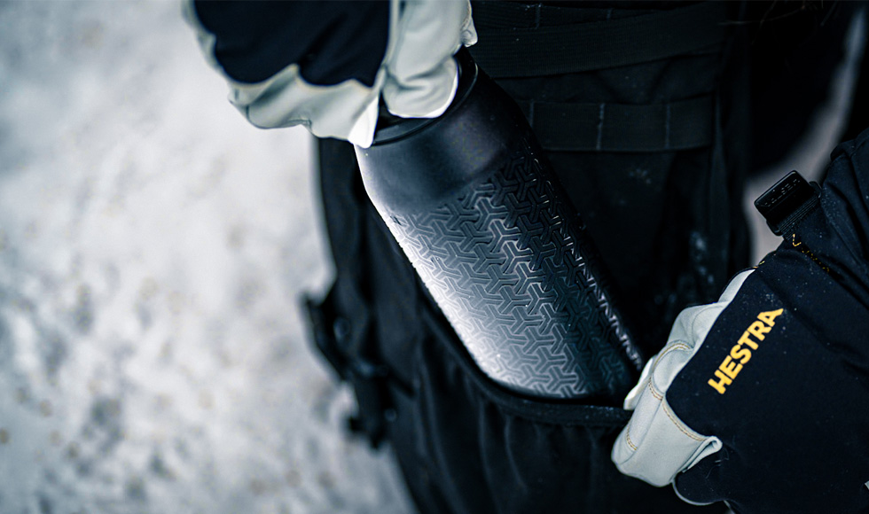 WATERBOTTLE BEING PULLED FROM BAG IN ALASKA