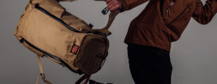 MAN RUNNING WITH COYOTE BROWN BACKPACK