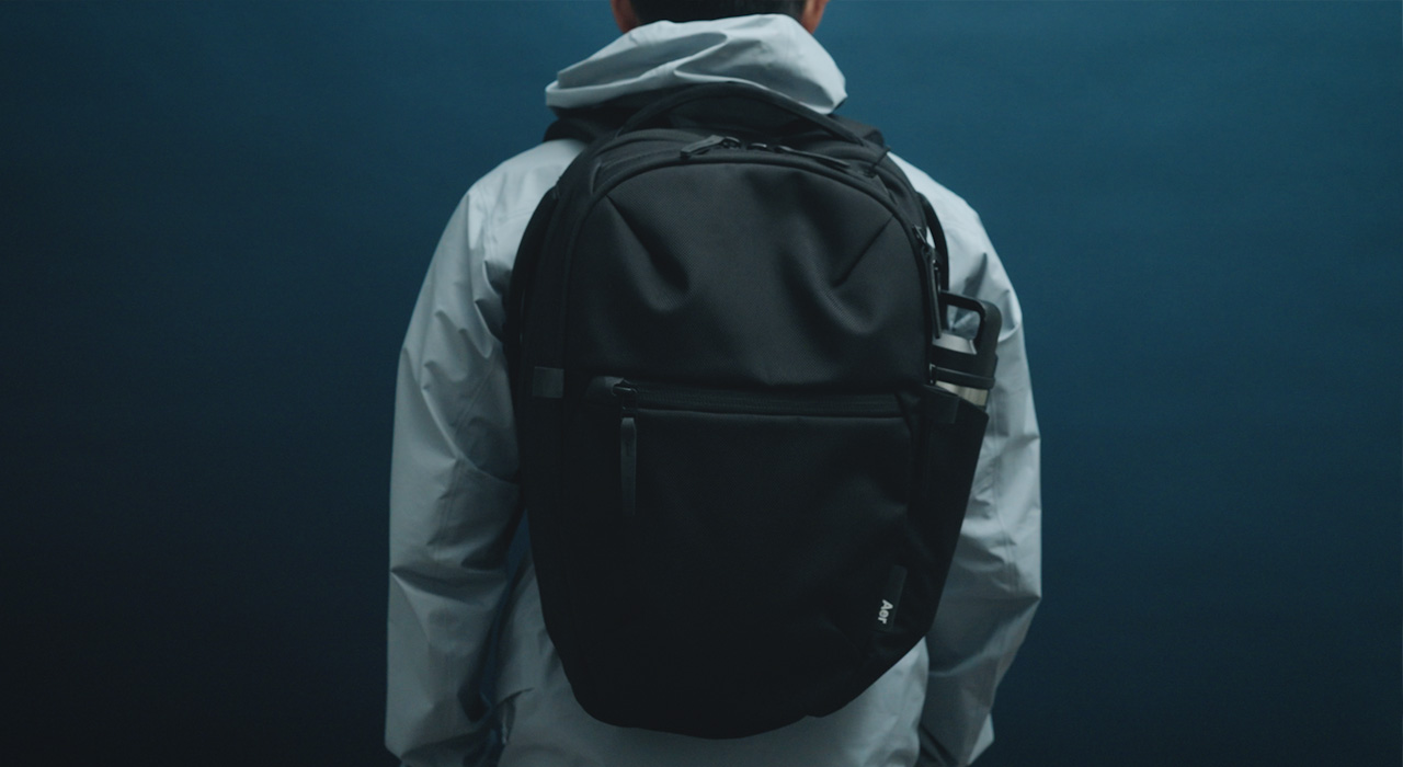 model wearing aer city backpack