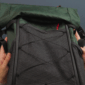lightweight backpack being packed by a set of hands