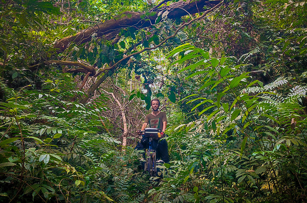 Explorer Jude Kriwald and his Bicycle in the Gola Rainforest