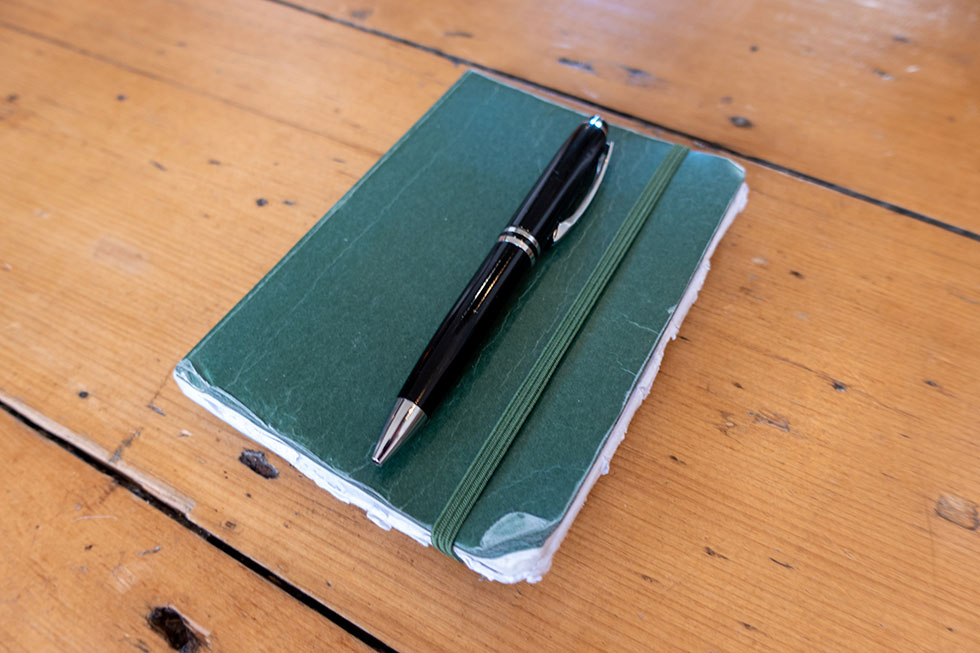 Journal and pen used on solo jungle cycling expedition by Jude Kriwald