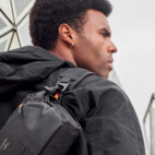 MODEL CARRYING LEATHER SLING IN CITY