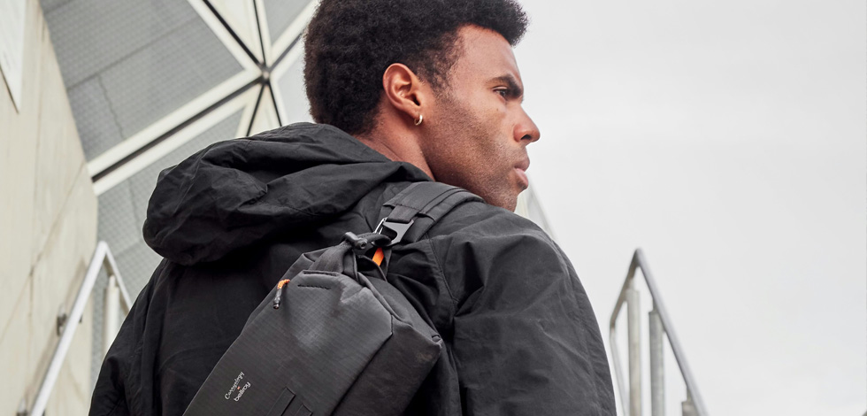 MODEL CARRYING LEATHER SLING IN CITY