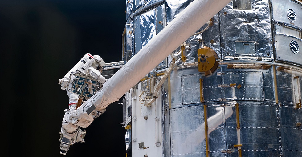 Astronaut John Grunsfeld works on repairs to the Hubble Space Telescope. Credit: NASA