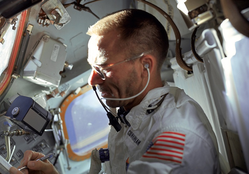 U.S. astronaut Walter Cunningham writes with a Fisher Space Pen during the flight of Apollo 7