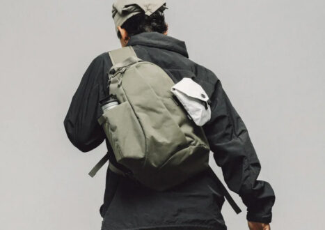model wearing sling on grey background