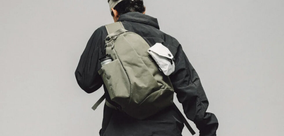 model wearing sling on grey background