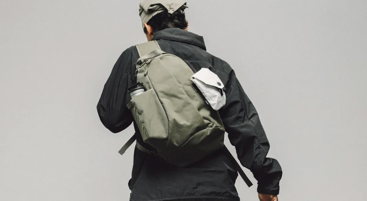 model wearing sling on grey background